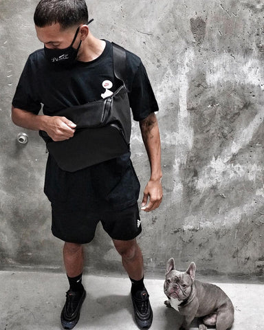 criztofferson wearing the byapptonly sidekick professional barber bag sling crossbody and puppy