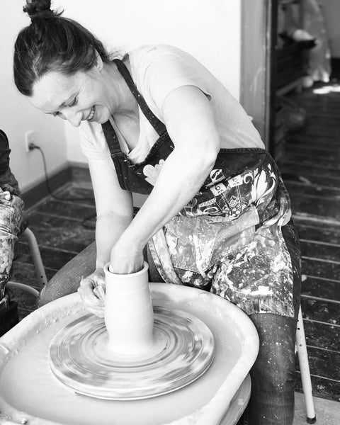 Katie Robbins hand throwing ceramics in a pottery in Denmark