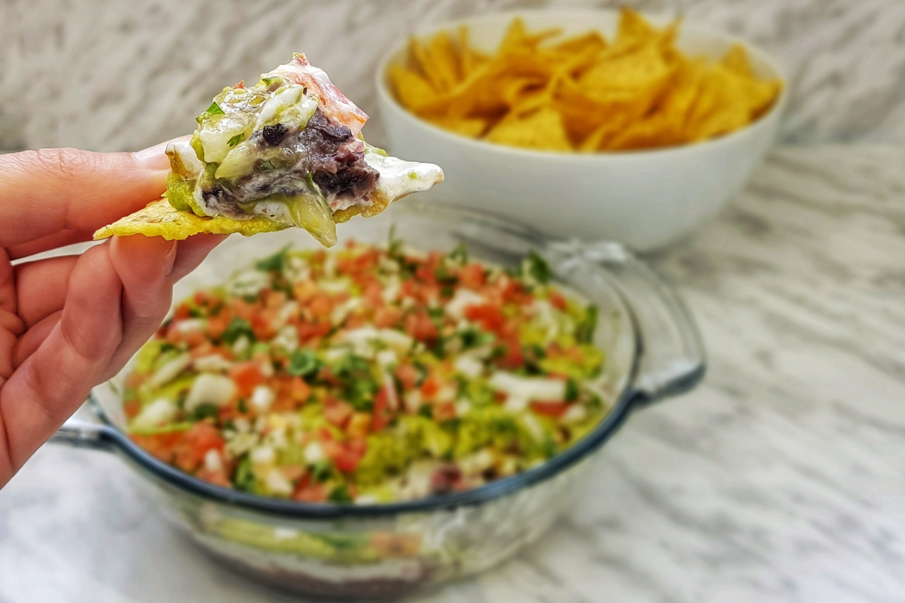 7 Layer Summer Dip - loaded tortilla chip