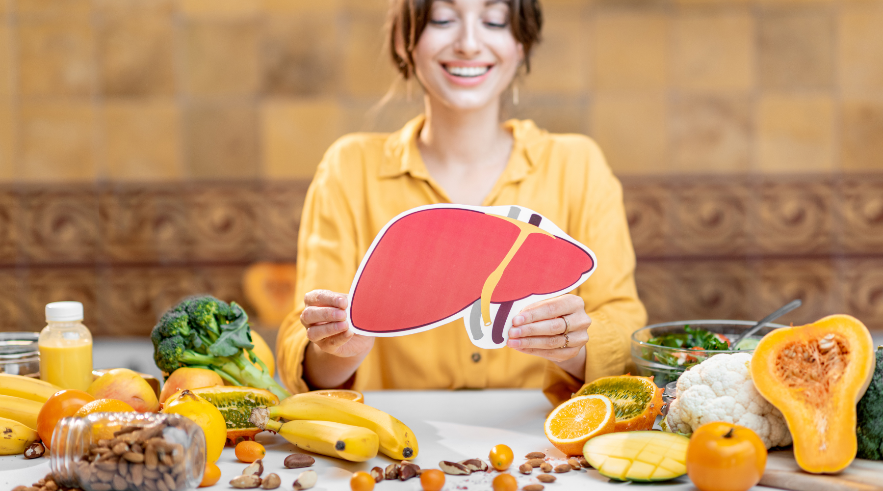 woman holding a liver photo in kitchen