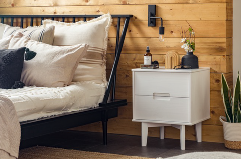 Solid pine wood nightstand in a bedroom