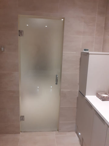 Frosted shower door with chrome hardware