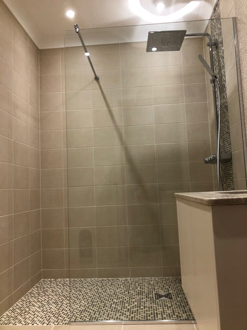 Frameless shower screen with chrome components