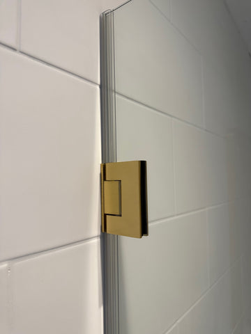 Wall to glass shower door hinge with satin brass finish