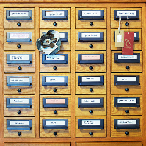 Front view of the card catalog that keeps the tools in the shop organized.