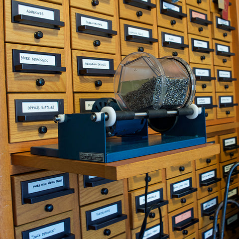 Rotary tumbler sitting on the card catalog.