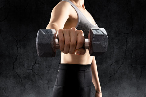 A woman holding the Nordic Lifrting's Prism Dumbbell