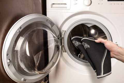 Putting a pair of knee sleeves in the washing machine