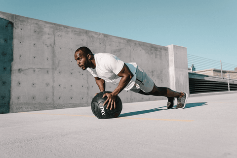 a man doing inclined push ups