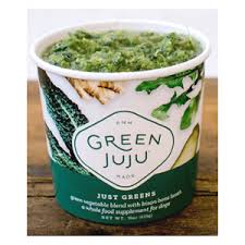 White carton that reads "GREEN JUJU" without a lid and a green slushee substance is inside