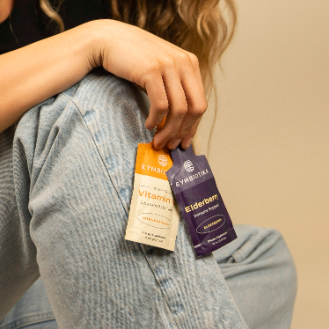 Model posing with Vitamin C and Elderberry