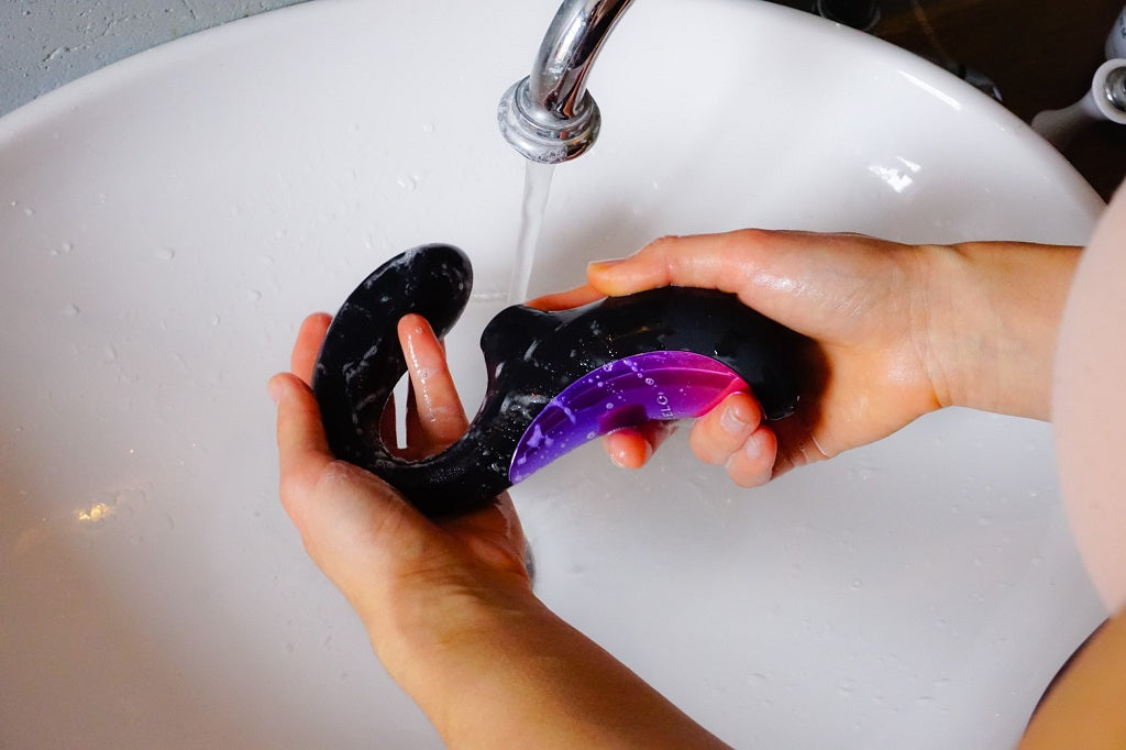 Washing a vibrator under a tap