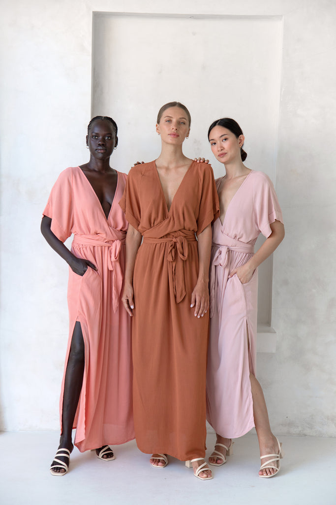 Three bridesmaids wearing Melody Maxi Dress in Cinnamon, Dusty Rose and Blush