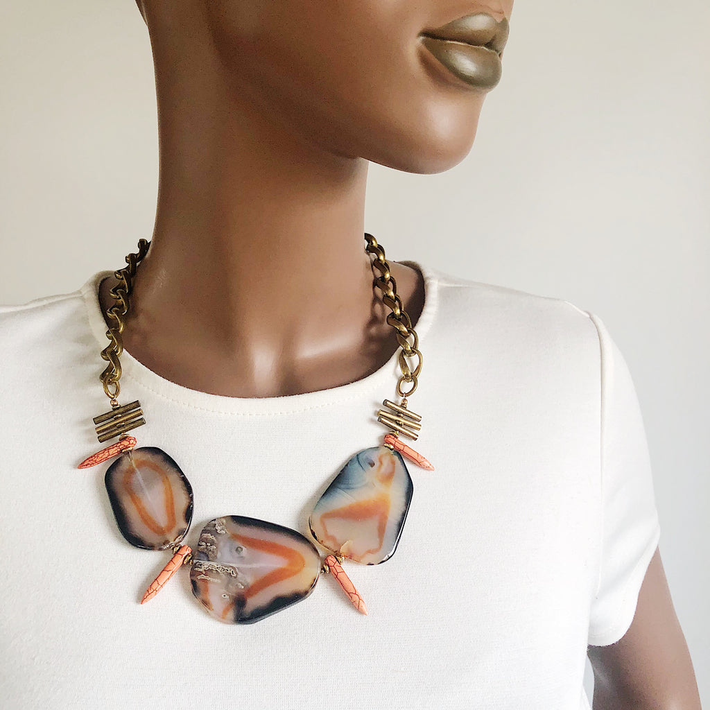 Semiprecious stone statement necklace by Third & Co. Studio handmade in Michigan with black and orange Agate slabs, orange Howlite spikes, brass accent bars and vintage brass chunky chain adjustable length