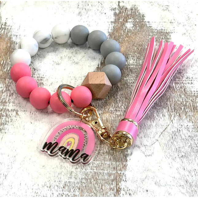 https://cdn.shopify.com/s/files/1/1826/7909/files/Custom-MAMA-Silicone-Tassel-Bangle-Bracelet-Kim-s-Korner-Wholesale-1686917873558.jpg?height=645&pad_color=fff&v=1686917875&width=645