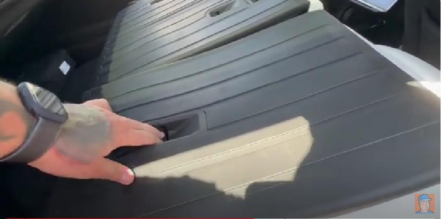 Push the seats back cover mat down