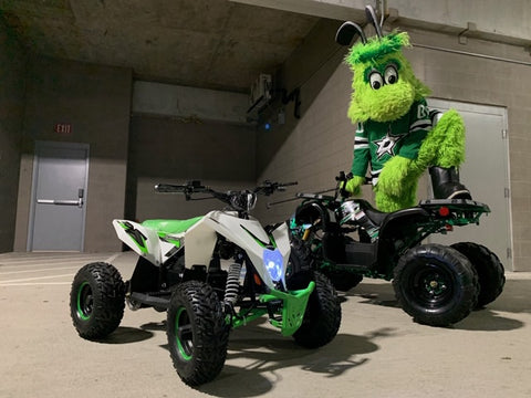 DALLAS STARS mascot riding electric battery powered Venom Motorsports ATV Victor e green