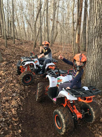 Venom Motorsports Grizzly 125cc Kodiak ATV two side by side with riders riding