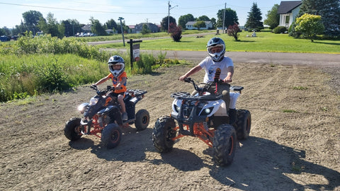 Venom Madix 110cc vs Venom Grizzly 125cc ATV side by side photo with riders