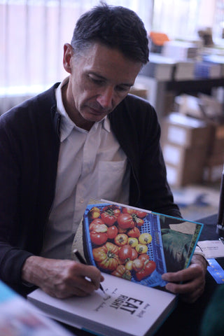 Nick Barnard signs a book