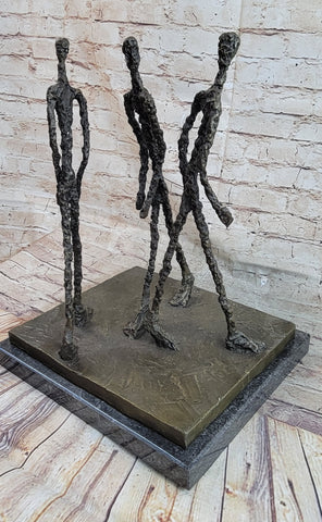 Three Walking Men by Alberto Giacometti