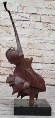 abstract bronze sculpture of a red guitar