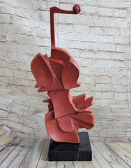 abstract bronze sculpture of a red cello