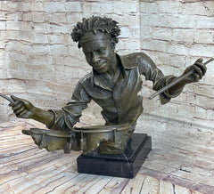 abstract bronze sculpture of an African American drummer