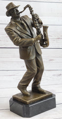 Bronze sculpture of an African American man playing saxophone