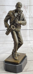 bronze sculpture of an African American saxophone player