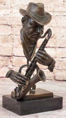 Abstract bronze bust sculpture of an African American jazz musician playing the saxophone