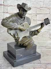 bronze sculpture of a country musician playing guitar