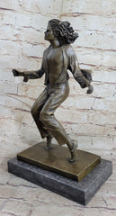 bronze sculpture of Michael Jackson on his toes, mid-dance
