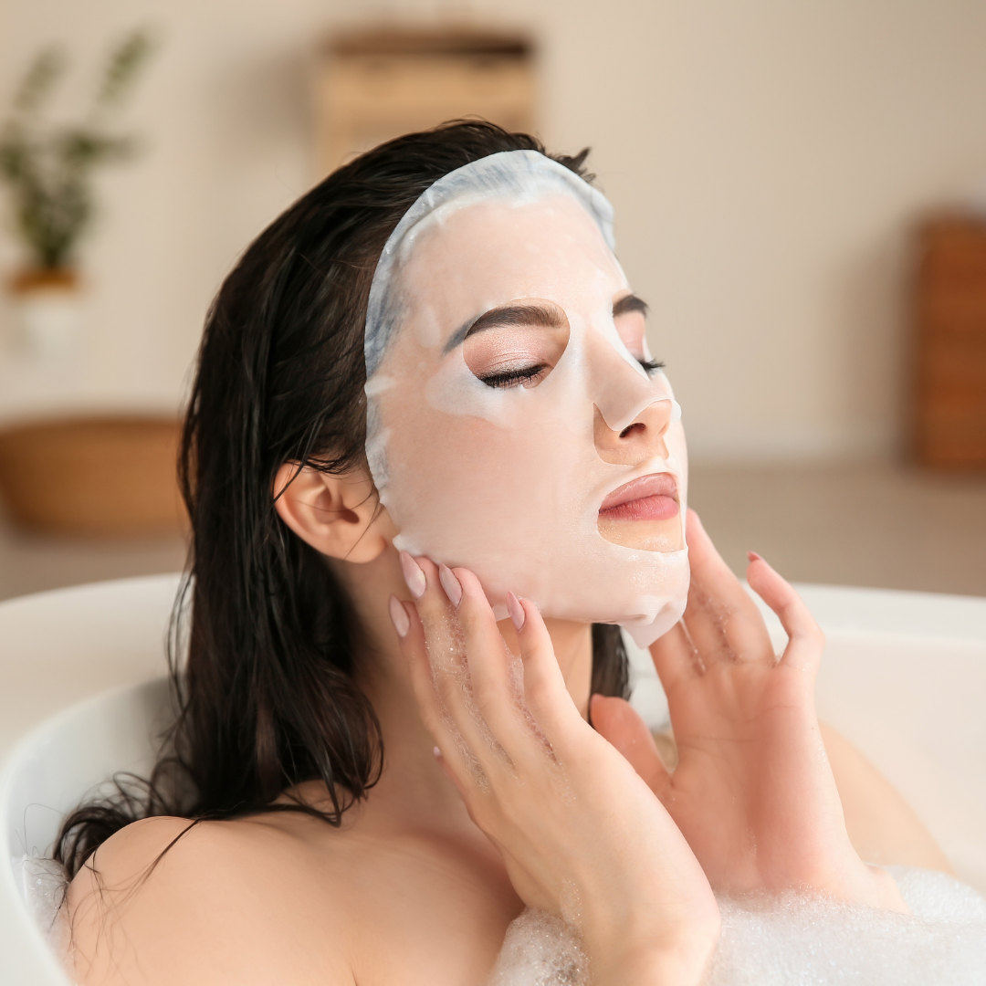 a woman taking a bath, wearing a MintBiology sheet mask