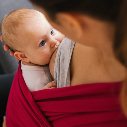breastfeeding. breastfeeding while standing. nursing in a baby wrap