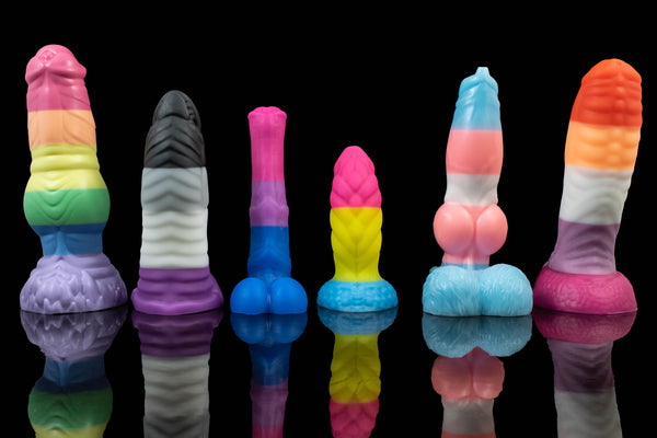 Line up of Pride Flag themed toys.