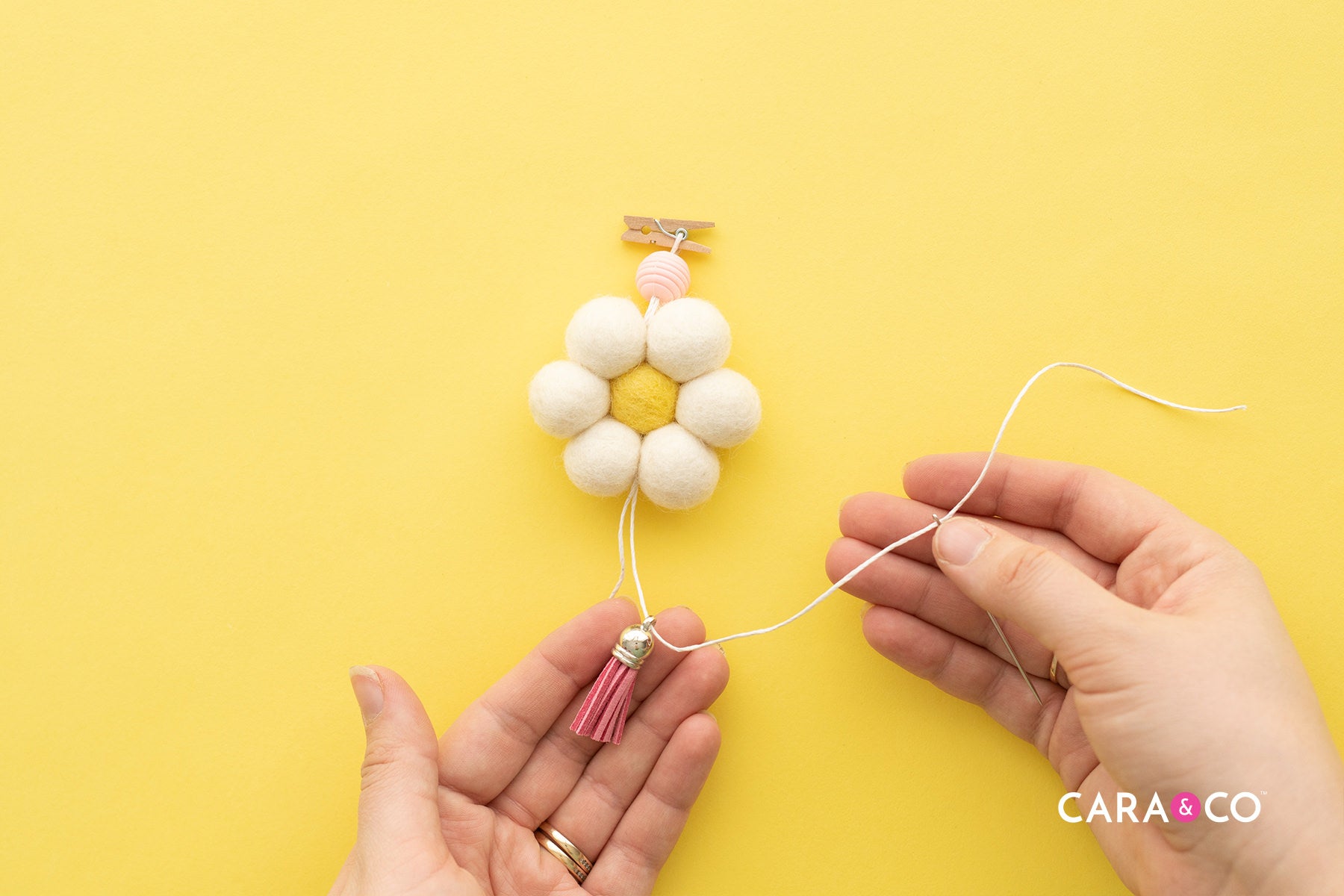 Add your tassel or charm onto your cord - Diffuser DIY Tutorial - Cara & Co