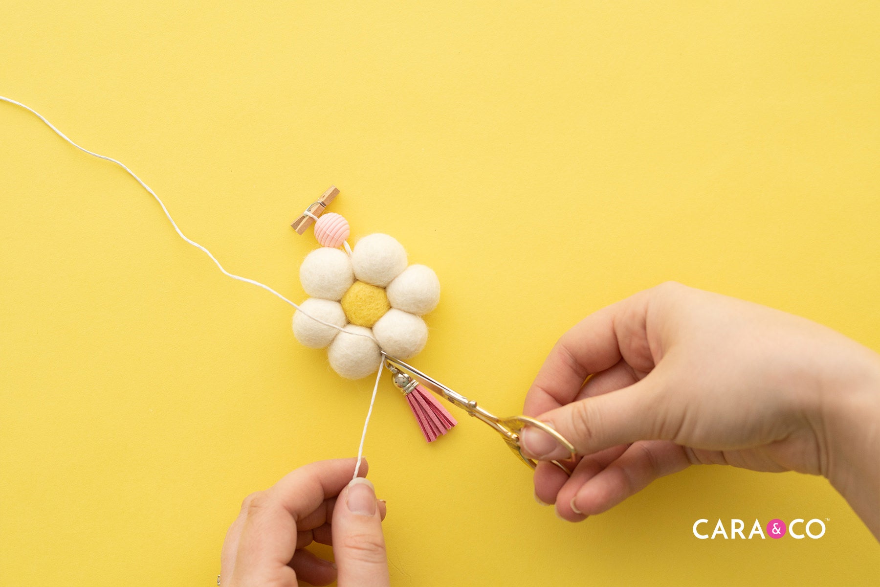 Trim the cord at your knot - Diffuser DIY Tutorial - Cara & Co