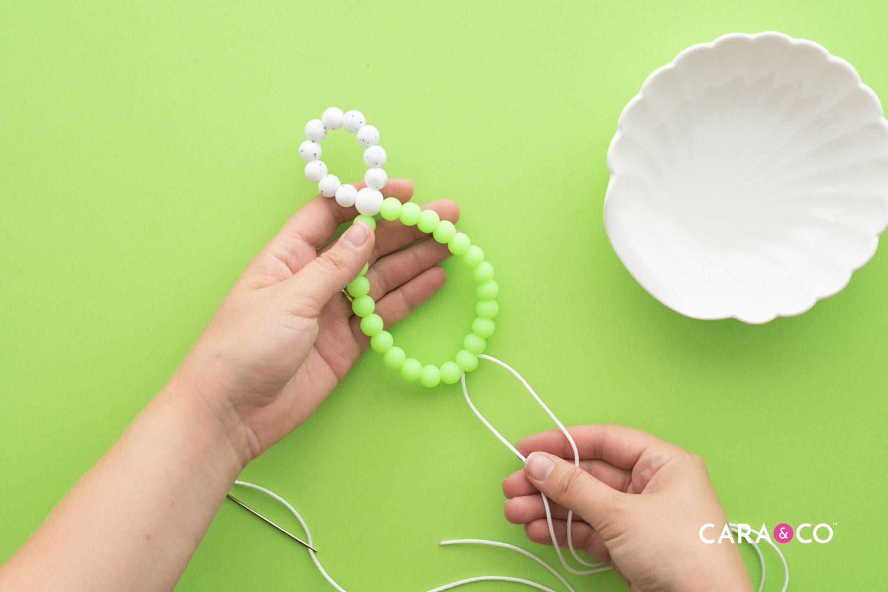 Pull the Knot into the Bead - Silicone Bead DIY Tutorial - Cara & Co