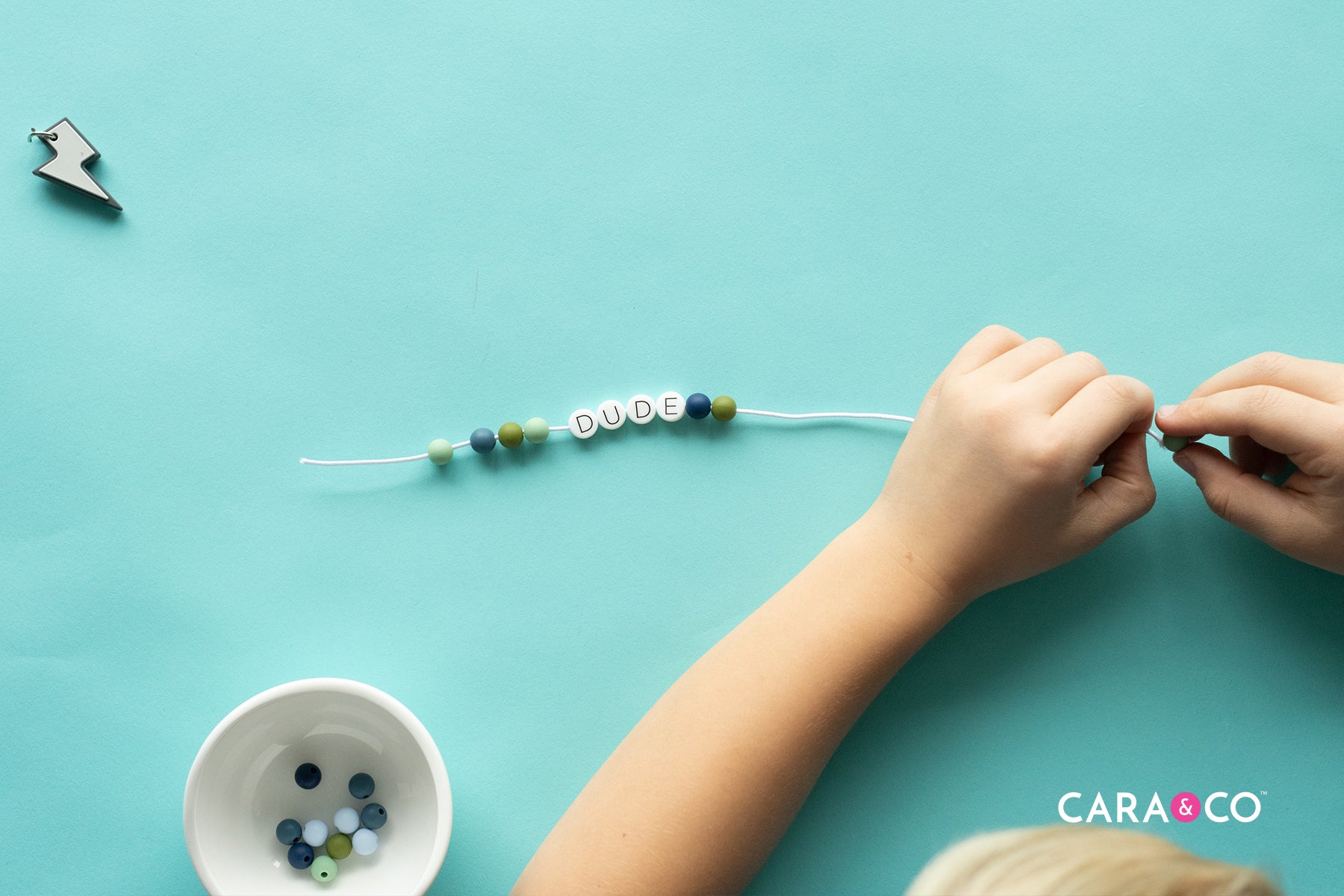 Thread all your bead onto your cord - Tutorial - Cara & Co