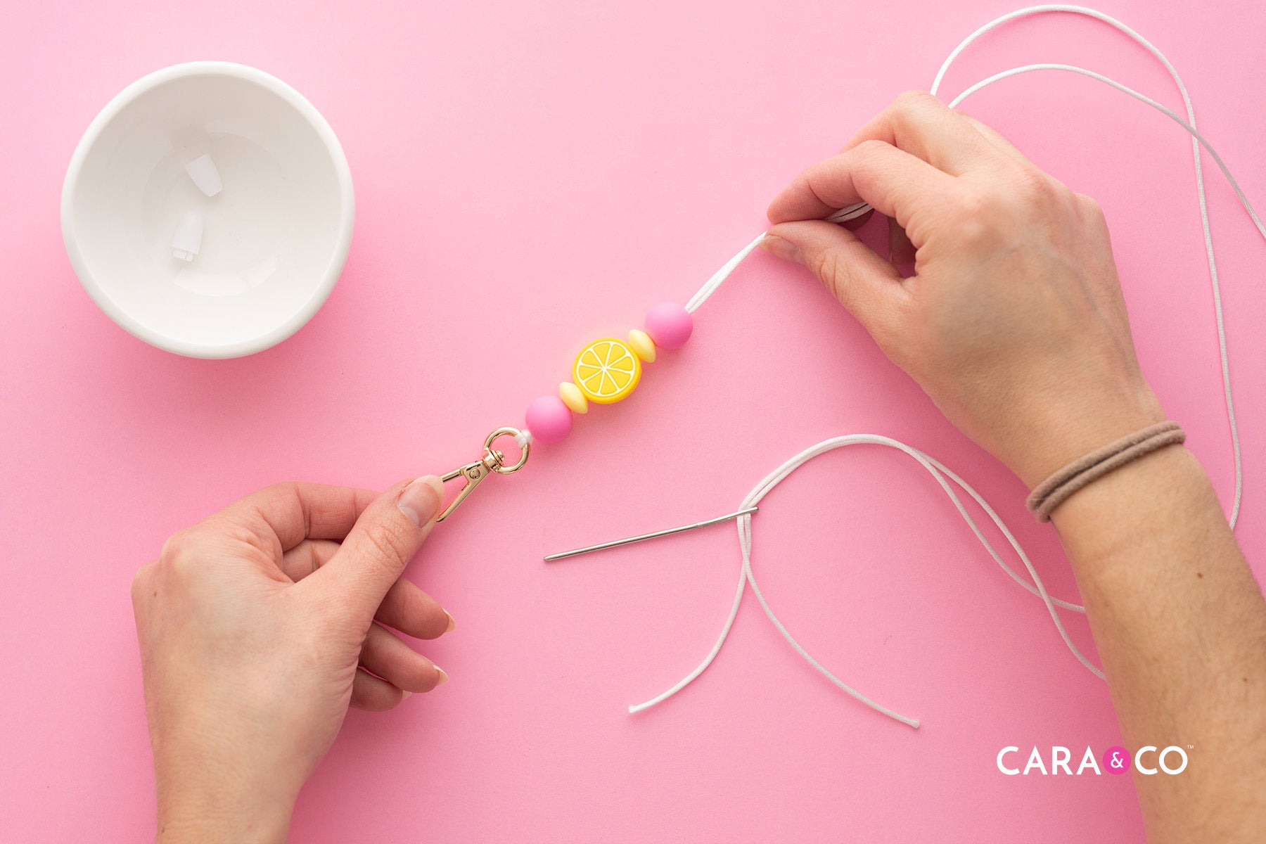 Thread your beads onto your necklace lanyard - Tutorial - Cara & Co