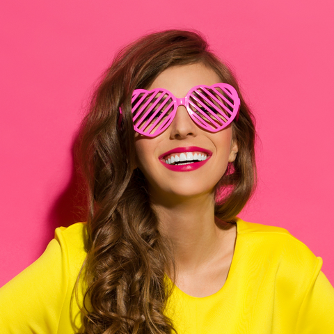 girl with yellow shirt and pink sunglasses