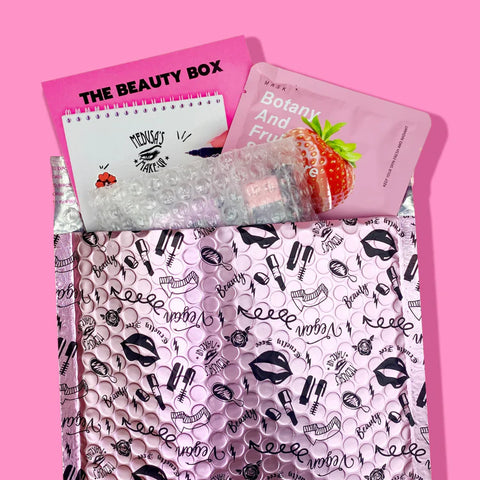 beauty box bag opened with products coming out