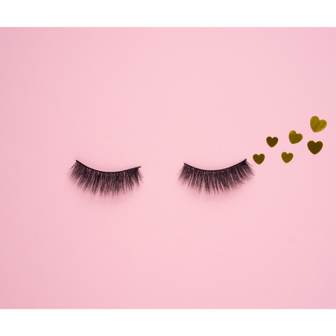 false lashes on a pink background