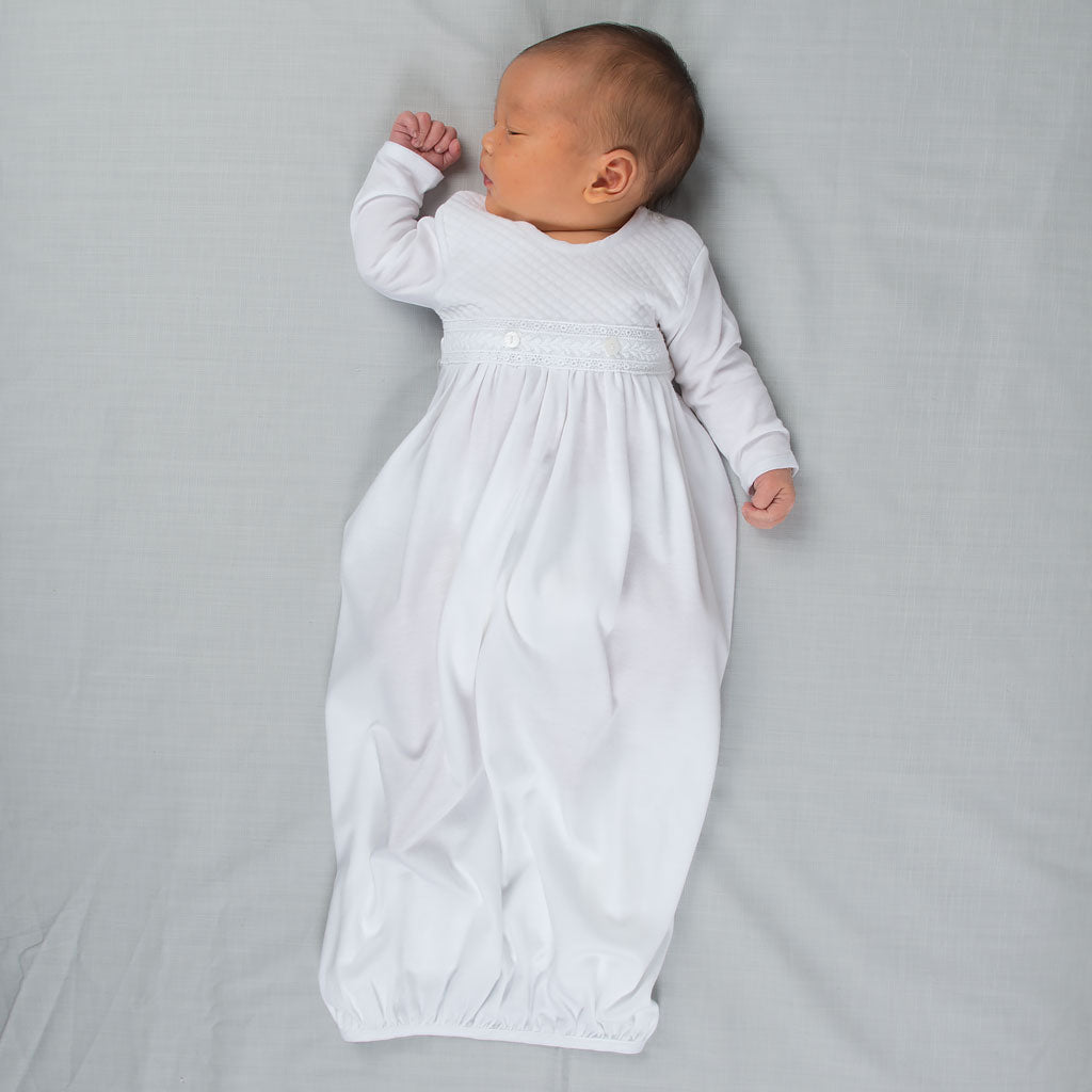 white newborn gown and hat