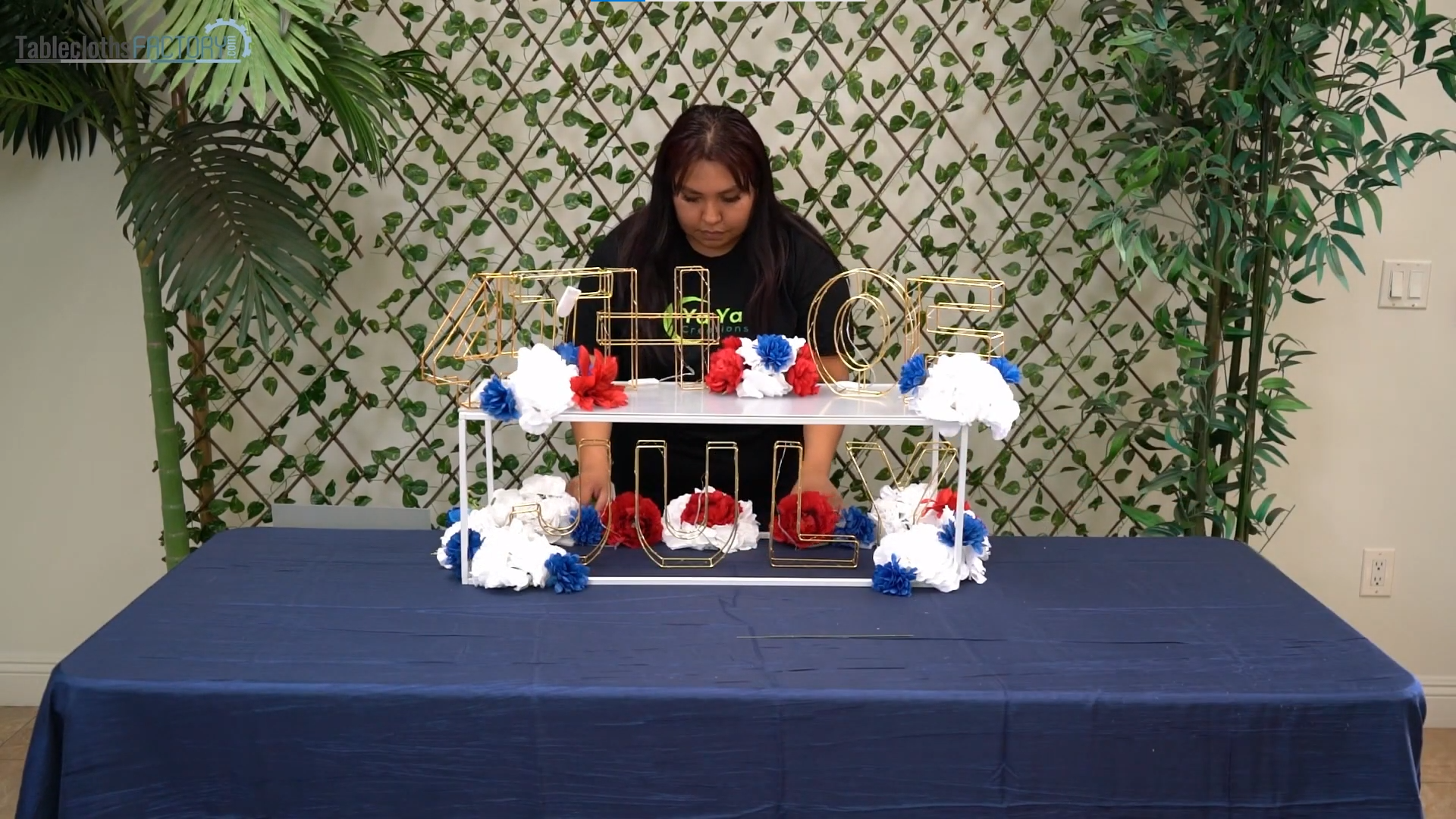 Woman arranging flowers around the centerpiece