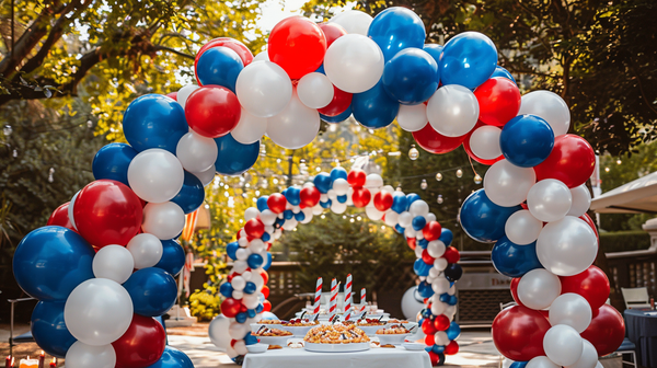4th of July balloon arch at a festive outdoor party.