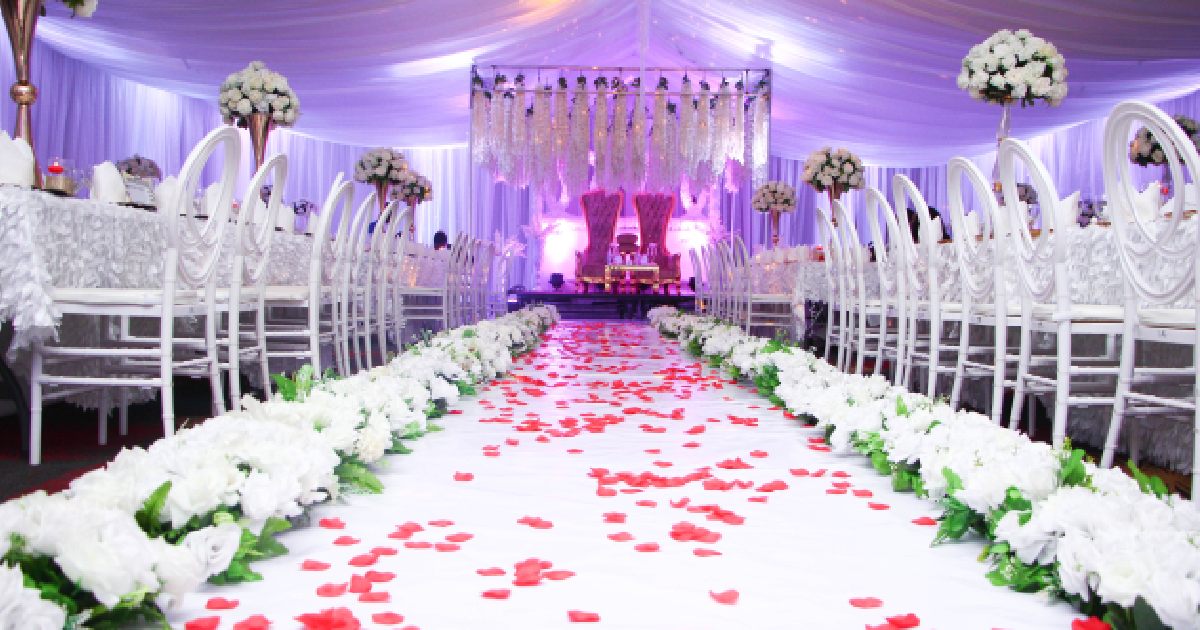 Wedding Aisle Decorated With Scattered Petals And Flower Arrangements