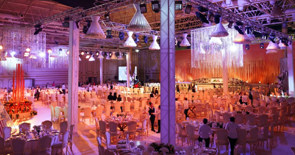 Winter Wedding Setup Featuring Lights and Fringe Ceiling Decor