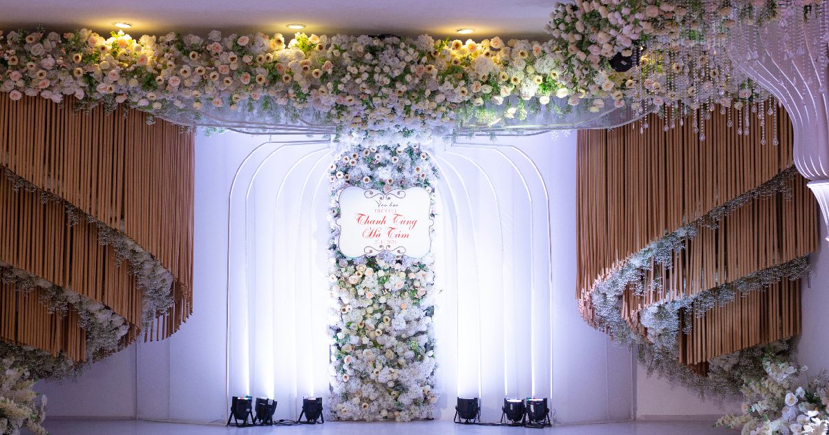 Winter Wedding With A Backdrop Decorated With Stands Strobe Lights Curtains And Flowers